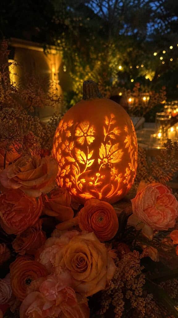Carved Pumpkin Luminaries With Orange Rose Clusters