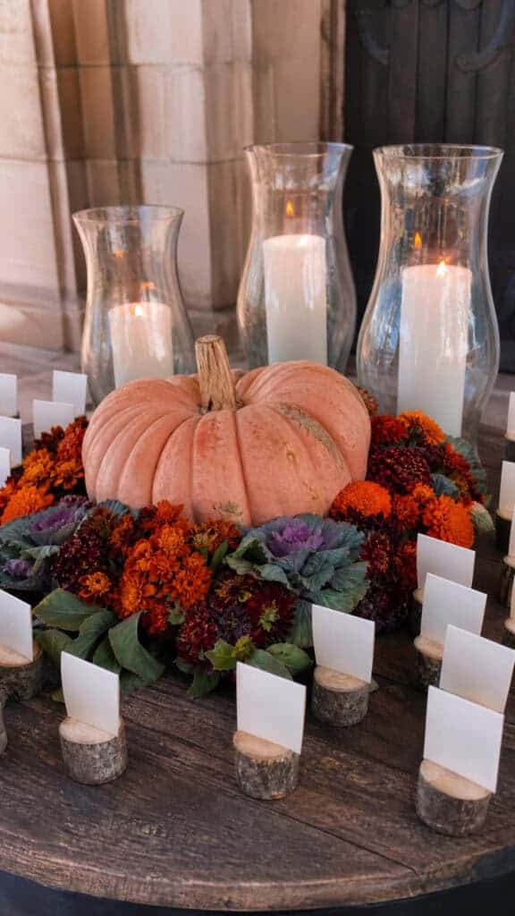 Pumpkin Escort Card Display With Marigold Accents