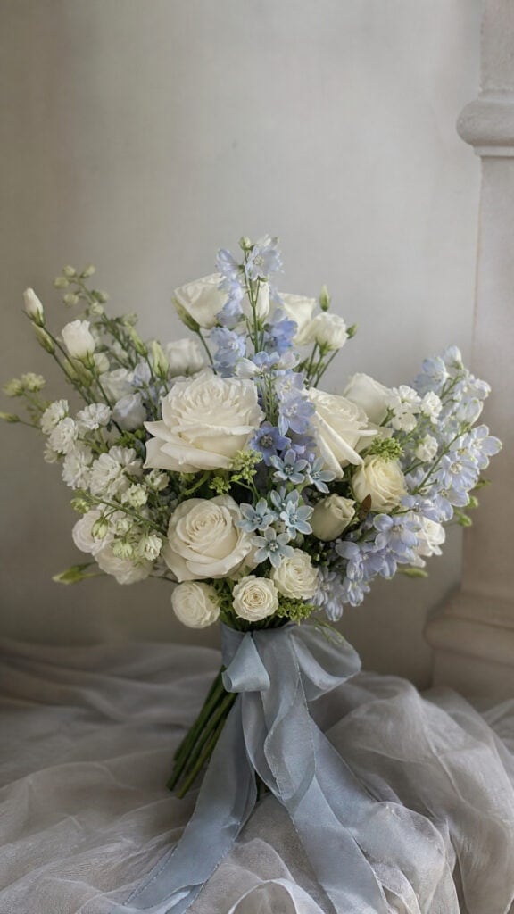 White Roses with Dusty Blue Accents