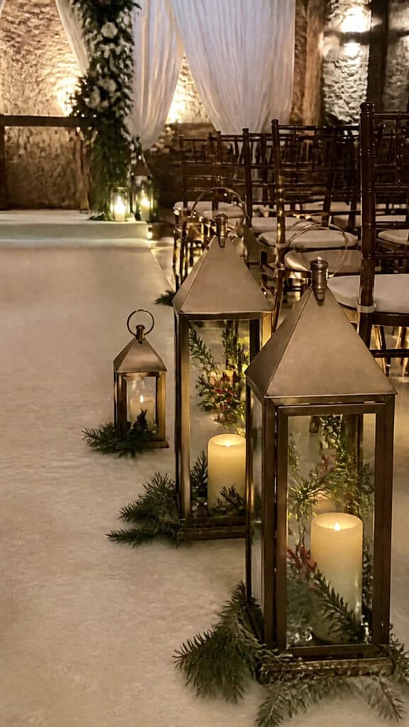 Lanterns Filled with Holiday Greenery