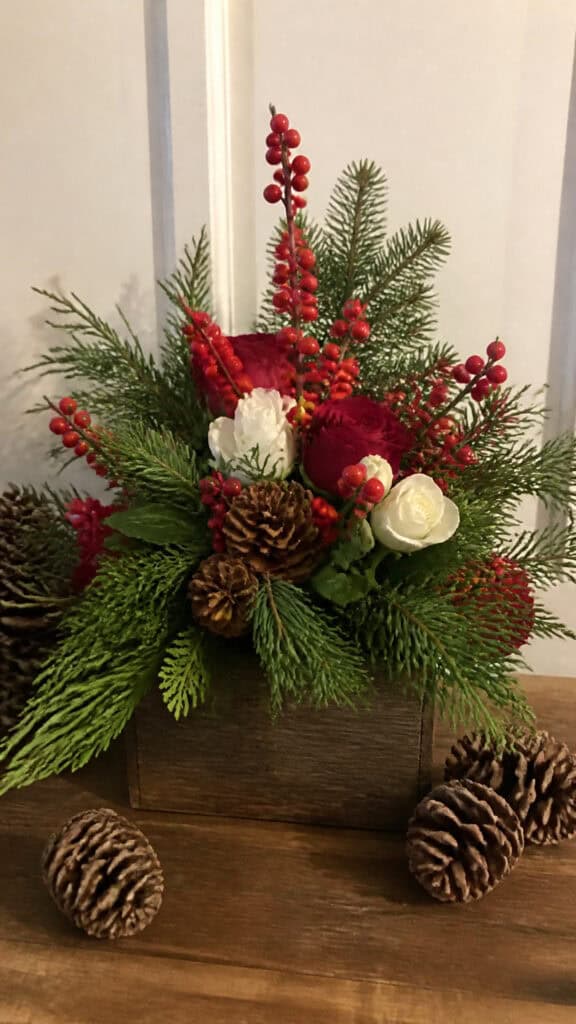 Festive Floral Arrangements with Berries and Pinecones