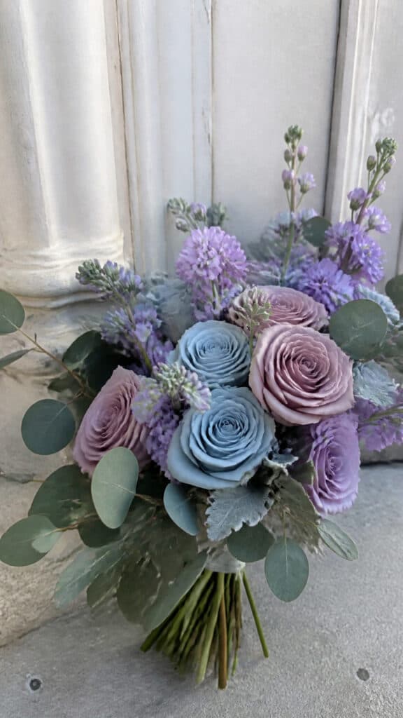 Dusty Blue and Mauve Rose Bouquet with Winter Greenery